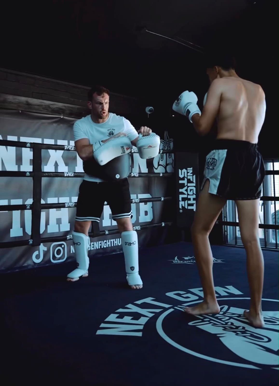 Holding pads for a fighter in the ring